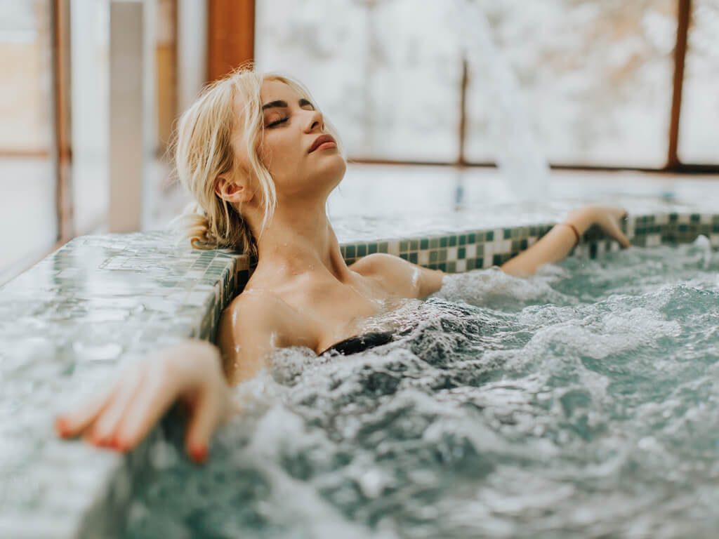 https://www.aqualeisurepoolsandspas.com/wp-content/uploads/2021/08/woman-relaxing-in-spa.jpg